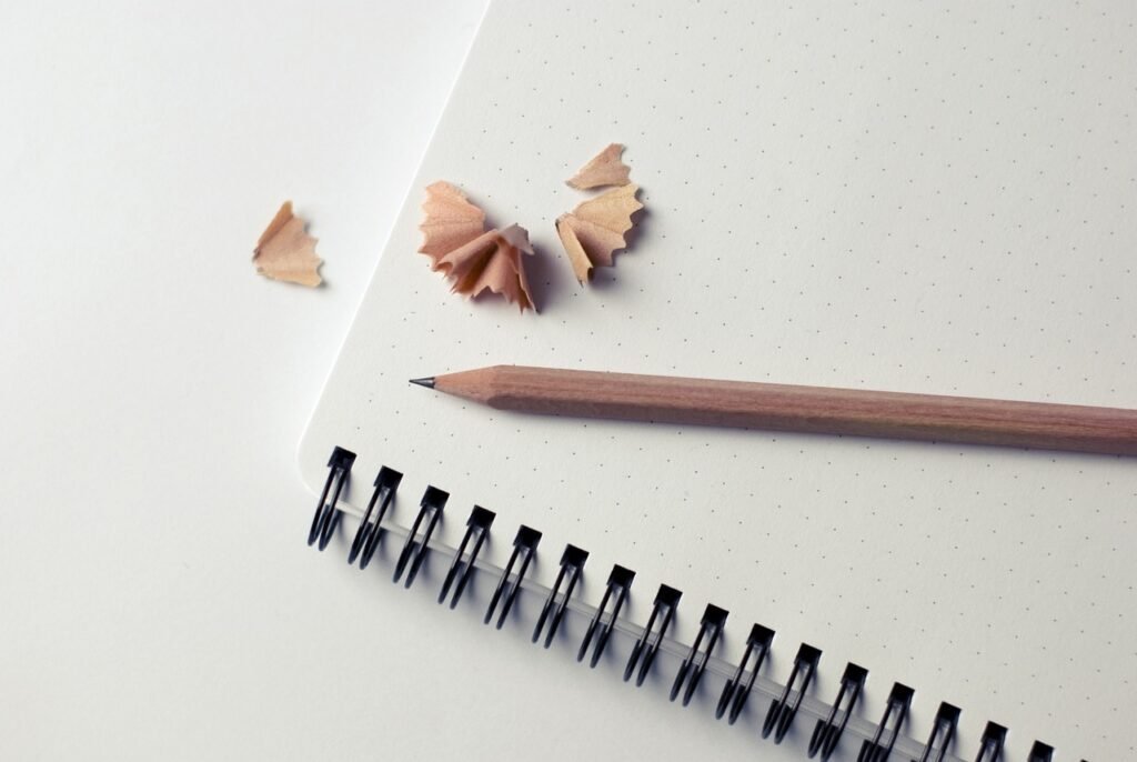 notepad, pencil, shavings